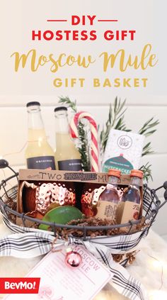 a gift basket filled with bottles of liquor and candy canes on top of a table