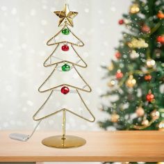 a small christmas tree on top of a wooden table