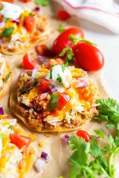 mexican style flatbreads topped with shredded cheese, tomatoes, onions and cilantro