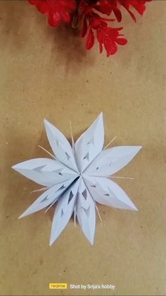 a paper snowflake sitting on top of a table