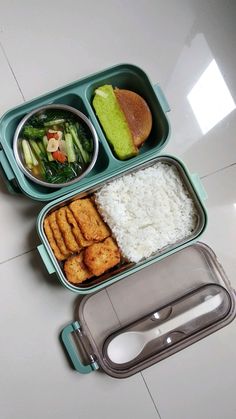 there is a lunch box with rice, meat and vegetables in it