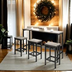 a living room with a fireplace, table and stools