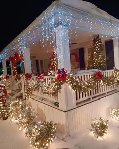 a house covered in christmas lights and garlands