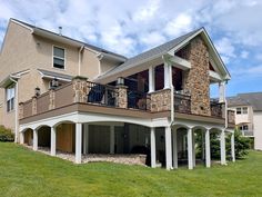 a large house with two balconies on the second floor