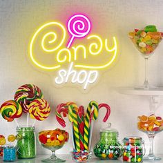 a candy shop with many different types of candies and lollipops on display