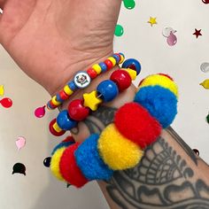 Clown pom pom beaded bracelet set clowncore accessories jewelry primary  Handmade clown bead bracelet set of 3 with chunky pom Pom bracelet and handmade fimo clay clown bead  ** CLOWN BEAD MAY CHANGE TO HAPPY FACE BEAD DEPENDING ON Availability! Perfect accessories to any fun outfit! Or cosplay  Tags;clown birthday party circus rave kidcore weird weirdcore kandi Clowncore Jewelry, Clowncore Accessories, Clowncore Kandi, Clown Kandi, Clown Stuff, Clown Accessories, Clown Core, Diy Kandi Bracelets, Silly Clothes