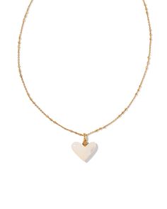 Show your love for the Western lifestyle with the Poppy Vintage Gold Short Pendant Necklace in Blush Pink Quartzite. An asymmetrical carved heart pendant shimmers along a vintage-inspired metal chain, creating a necklace layering staple that you’ll fall for time and time again. This necklace is a part of Yellow Rose by Kendra Scott—a brand that celebrates ranch life with Kendra Scott staples alongside select curated jewelry pieces and accessories. Metal Vintage 23k Yellow Gold Over Brass Material Blush Pink Quartzite Closure Lobster Clasp Size 16" Chain With 3" Extender, 0.87"L X 0.67"W PendantDue to the one-of-a-kind nature of the medium, exact colors and patterns may vary slightly from the image shown. | Kendra Scott Poppy Vintage Gold Short Pendant Necklace in Blush Pink Quartzite | Qua Pink Quartzite, Short Pendant Necklace, Western Lifestyle, Carved Heart, Gold Shorts, Necklace Layering, Ranch Life, American Southwest, Long Pendant Necklace