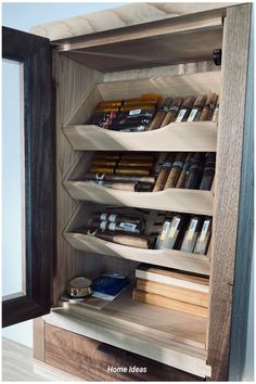 an open bookcase with many books on it and some other items in the shelves