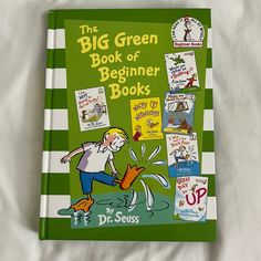 the big green book of beginner books by dr seuss is on a bed