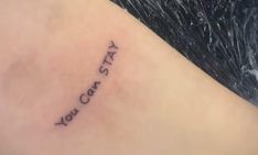 a woman's arm with the words tatsy and you cant written on it