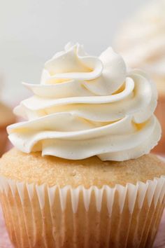 a cupcake with white frosting on top