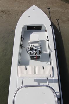 the inside of a white boat on water