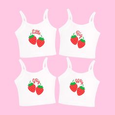 four white crop tops with strawberries on the front and one has red lettering that says,