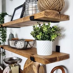 some shelves with plants and cutting boards on them