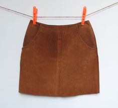 "Short skirt with lined pockets. Invisible zipper on the side.  Material: Genuine suede, 100% Leather  Size: 13  Length: 17 3/4\" or 45.5 cm  Front waist width: 16\" or 41 cm  Front hip width: 21\" or 54.5 cm  **Small defect: see close-up at the bottom of the zipper." Brown Suede Skirt, Suede Skirt, Camel Color, Invisible Zipper, Cowboy And Cowgirl, Brown Suede, Skirt Pattern, Western Fashion, Leather Skirt