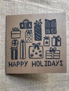 a card with the words happy holidays surrounded by gift boxes and wrapped presents on it