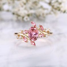 a pink ring sitting on top of a white table