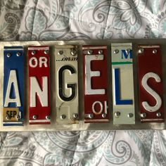 the los angeles license plates have been altered to look like they are hanging on a wall