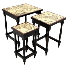 three tables with maps on them sitting next to each other