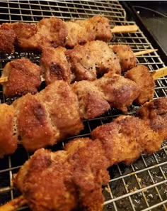 chicken skewers are being cooked on the grill