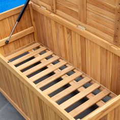 the inside of a wooden sauna with its doors open