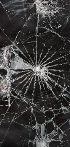 a broken glass window that has been smashed