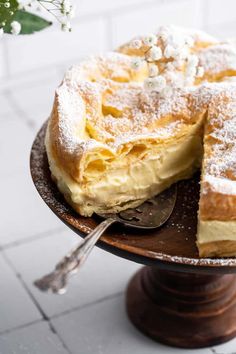 a cake sitting on top of a wooden plate