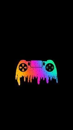 a video game controller painted in rainbow and black with paint drips on the side