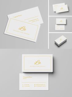 some business cards with gold foil on them and white paper in the bottom right corner