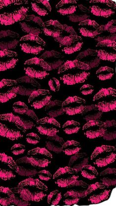 a black and pink background with lots of red lipstick prints on the bottom half of it