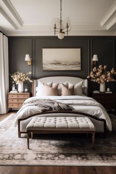 a large bed sitting in a bedroom on top of a hard wood floor next to a window