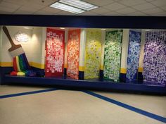 an empty room with brightly colored glass walls