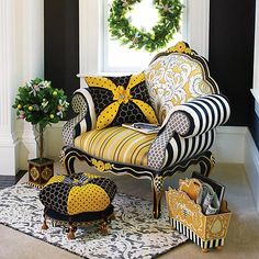 a chair and ottoman in front of a christmas wreath