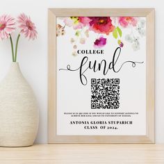 a vase with flowers and a qr code on it next to a framed poster