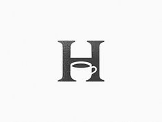 the letter h with a cup of coffee on it is shown in black and white