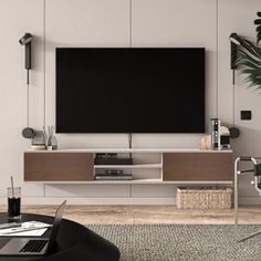 a living room with a large flat screen tv on the wall