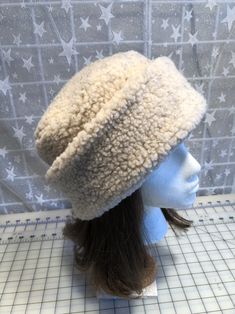 I made this warm pillbox style hat out of ivory Berber fleece for warmth and comfort. The body of the hat is ivory Berber and the hat is lined with fleece. The hat is a double layer of fabric for extra warmth and comfort. It's sized to fit most adults 22-23 inches around head. It has a nice soft feel and is completely machine washable and dryable. A great travel hat. Also available in black, charcoal, creamy white, camel or light gray. The photos are of the ivory hat. Last picture shows color di Cream Cap For Cold Weather, Winter Brimmed Hat With Plush Lining, Sherpa Hat, Beige Winter Cloche Hat, Fur Felt Cloche Hat For Winter, Winter Fur Felt Brimmed Cloche Hat, Winter Fur Felt Cloche Hat, Ivory Pillbox Hat, Christmas Party Hats