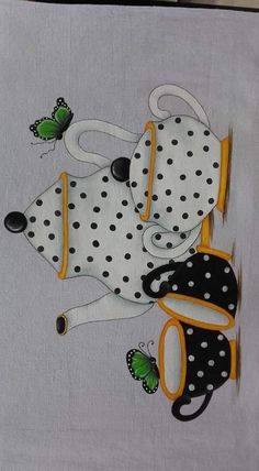 a white towel with black and yellow polka dots on it, depicting two dogs laying next to each other