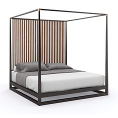 a bed with a metal frame and wooden slats on the headboard is shown