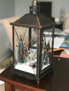 an old fashioned lantern is sitting on a table