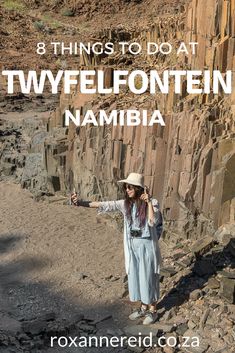 a woman standing on top of a rocky cliff with text overlay that reads 8 things to do at twylfontein nambia