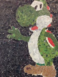 a mosaic with an image of a frog on it