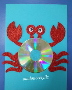 a cd and crab on a blue background