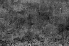 black and white photograph of an old concrete wall