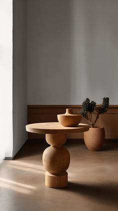 three vases sitting on top of a wooden table