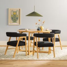 a wooden table with four chairs around it