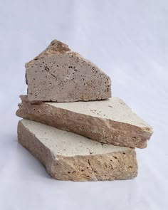 three pieces of stone stacked on top of each other