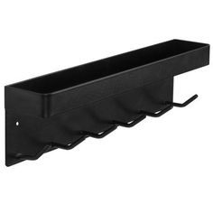 a black wall mounted shelf with four hooks on the bottom and one hanging from it's side