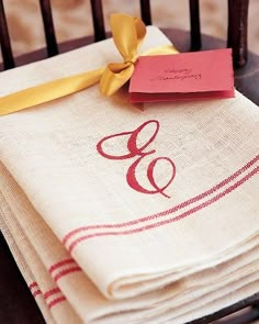 a stack of napkins sitting on top of a wooden chair