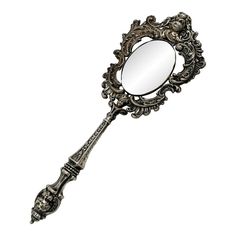 an ornate looking mirror is shown against a white background